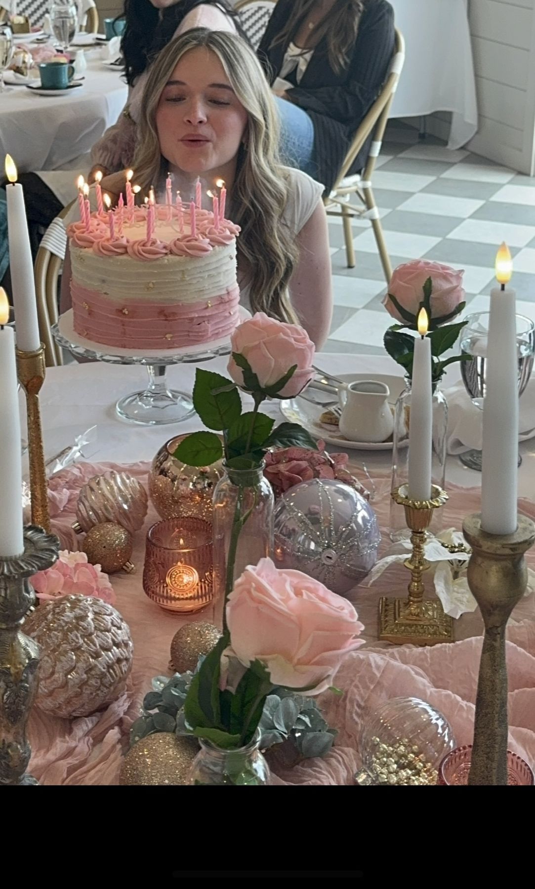Birthday cake and candles on a vintage cake stand