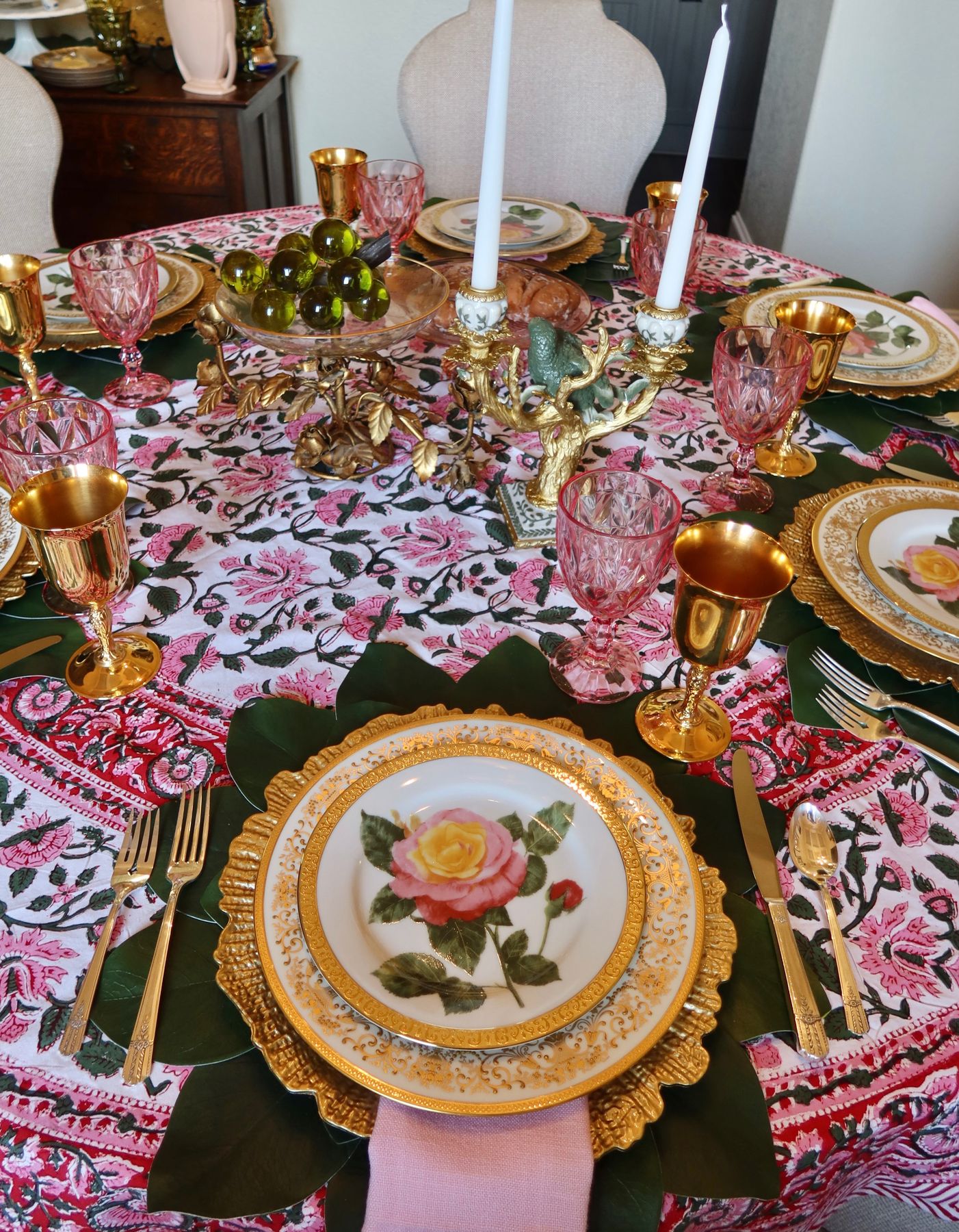 A blush and gold place setting with vintage china and cut glass
