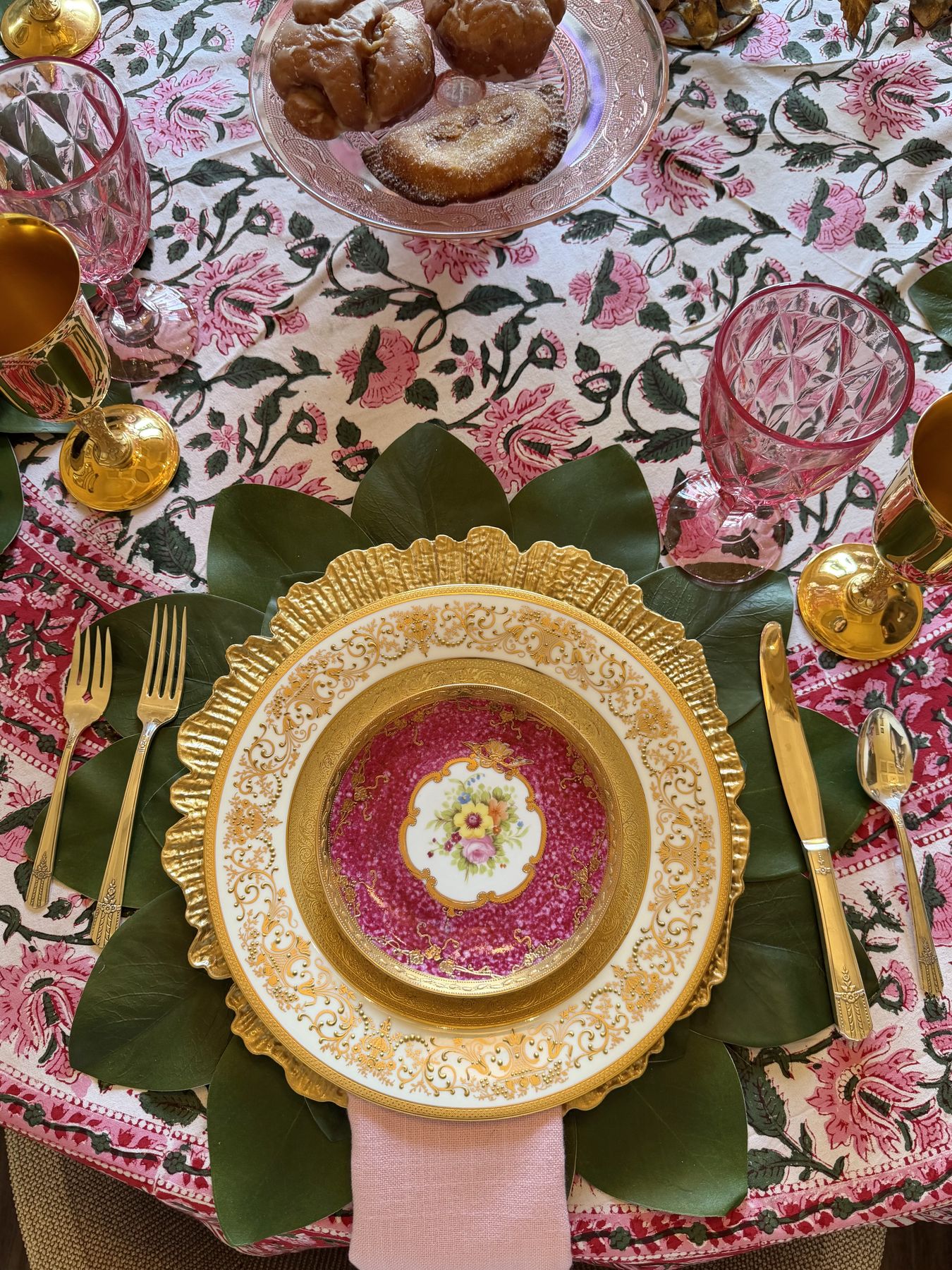 Pastries and blush linens on a tea table