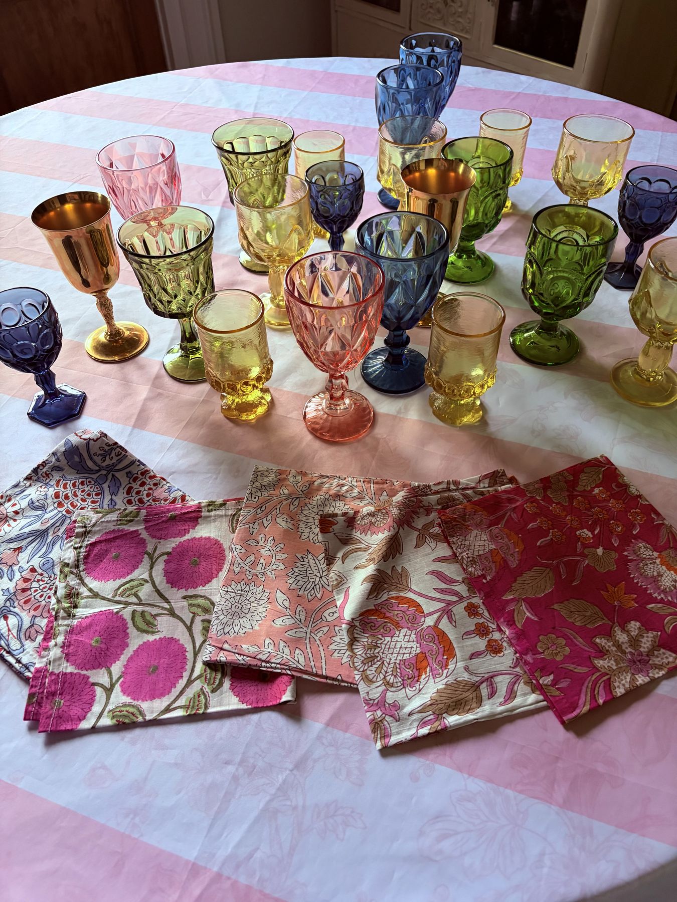 Colored vintage goblets and block-printed napkins
